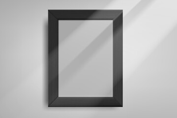 Black photo frame on bright wall with sun beam. 3d vector mockup