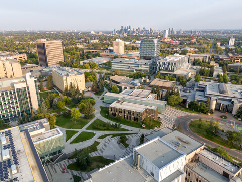 Aerial view of the University of Calgary campus with the city skyline in the distance. 