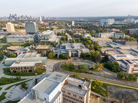 Aerial view of the University of Calgary campus with the city skyline in the distance. 