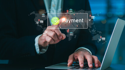 Businessman using laptop and touching virtual payment icon with secure digital finance interface, representing online banking, fintech, e-commerce, and global financial technology innovation.
