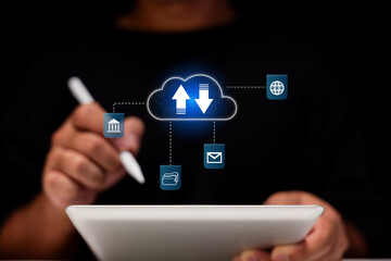 A person uses a tablet to interact with cloud icons, representing data transfer, communication, and connectivity in a digital environment.