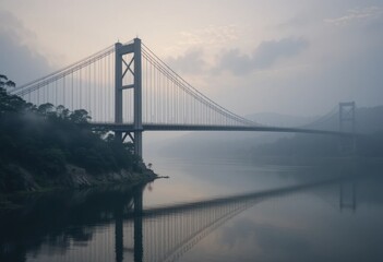 Obraz premium Puente colgante sobre un río tranquilo, rodeado de niebla matutina, que combina la serenidad natural con la belleza de la ingeniería humana