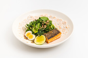 Fresh grilled salmon with greens, eggs, and creamy dressing