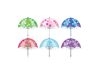 Collection of six colorful decorative mini umbrellas with playful patterns and lace trim on white background