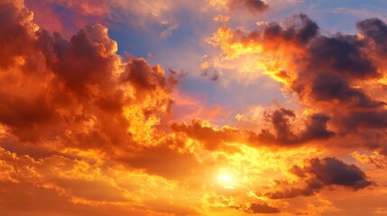 A stunning display of colors shines across the sky during sunset. Bright orange, red, and purple clouds create a breathtaking backdrop above a tranquil horizon as the sun sets.