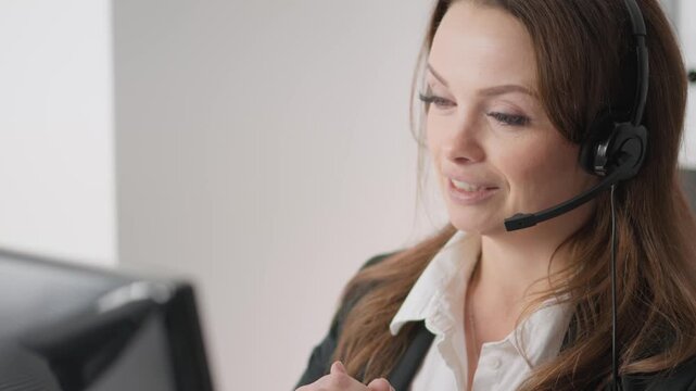 In a modern office, a skilled customer service agent uses a headset to interact with clients, demonstrating professionalism and focus to ensure customer satisfaction in every engagement