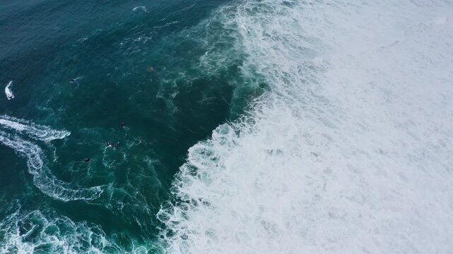 4K video of Personal watercrafts PWC on Atlantic ocean waves during international surfers challenge in Nazare, Farol da Nazar&eacute;, Portugal where Guinness World Record for highest surfing was set
