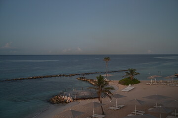 Curacao, Willemstad - aerial view over the beach of a beautiful luxury hotel at sunrise 