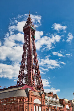 Blackpool Tower and Building Against Cloudy Blue Sky