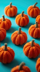 Adorable Knitted Pumpkins on Teal Background - Autumn Harvest Crafts