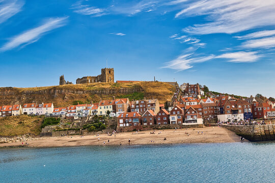 Coastal Town with Beach and Hillside Buildings in Whitby, UK.