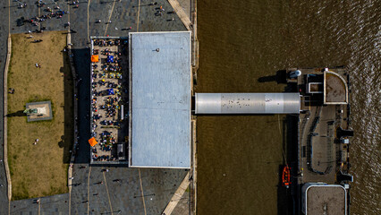 Aerial View of Pier, Water, and Pedestrians  in Liverpool, UK.