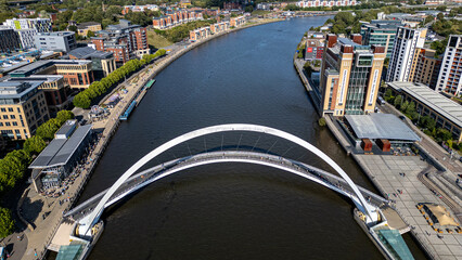 Aerial View of River Tyne with Gateshead Millennium Bridge and Cityscape  in Newcastle upon Tyne, UK