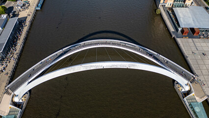 Arch Bridge Over River with Pedestrians  in Newcastle upon Tyne, UK.