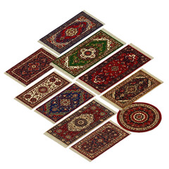 Colorful assortment of miniature dollhouse rugs with traditional Oriental patterns and white fringe.