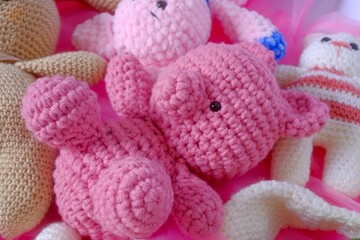 Close-up of colorful crocheted stuffed animals.