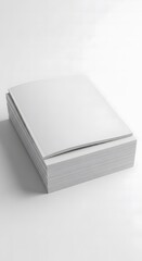 Fototapeta premium A clean and minimalist mockup of a thick stack of blank white magazines or brochures with soft covers, perfect for presenting design concepts or branding presentations on a simple white background