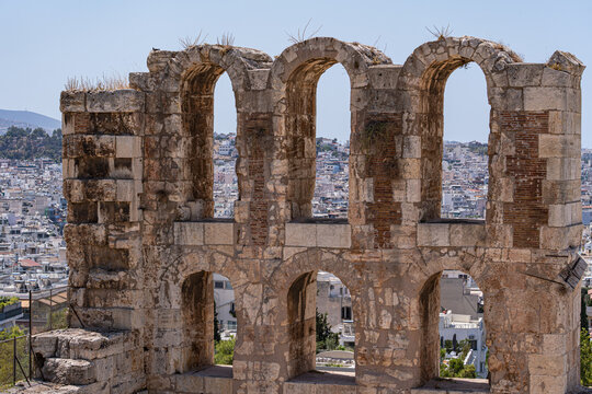 Cityscape view through the Old Ruins of the Odeon of Herodes Atticus, Athens, Attica, Greece