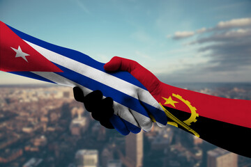 Shaking hands Cuba and Angola