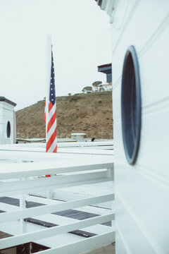 Close-up of an American flag on a wooden pier, Malibu, California, USA