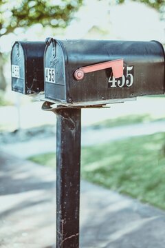 Close-up of two metal mailboxes side by side in a street, USA
