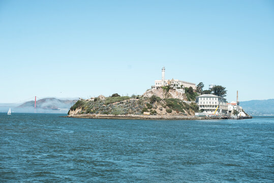 View across San Francisco Bay of Alcatraz island and the Golden Gate Bridge in the distance, San Francisco, California, USA