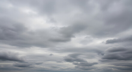 Fototapeta premium Gloomy sky filled with gray clouds creating a dramatic and overcast scene