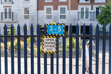 Urban scene with warning signs and fence
