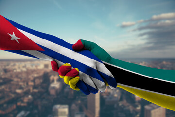 Shaking hands Cuba and Mozambique