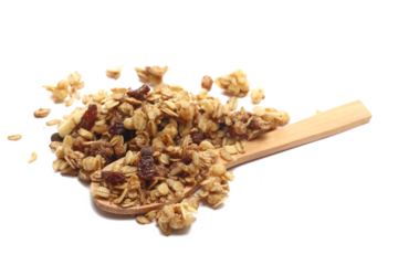 Crunchy granola, muesli pile with banana slices and chocolate in wooden spoon isolated on white background, side view