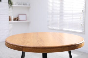 Empty wooden table indoors, closeup. Stylish furniture