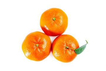 Juicy shiny tangerines with leaves isolated on white background.