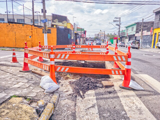Pothole in the city center at a traffic intersection