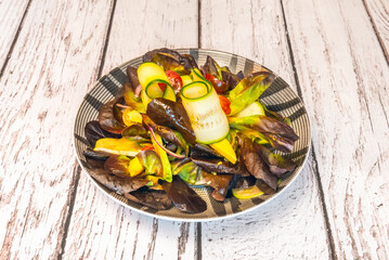 Baby spinach salad with canned tuna, poached egg, whole-wheat croutons, and sun-dried tomatoes, with a honey and mustard dressing.