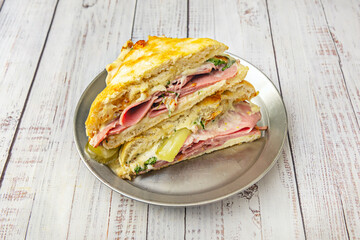 Pastrami Sandwich: Cured and smoked beef, sauerkraut, Swiss cheese, and spicy mustard on rye bread