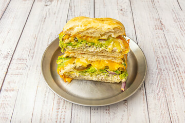 Pesto Chicken Sandwich: Grilled chicken, homemade basil pesto, and fresh mozzarella on ciabatta bread
