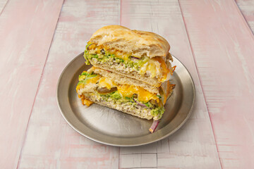 Chicken and Avocado Sandwich: Grilled chicken breast, lime-smashed avocado, and crispy bacon on whole wheat bread