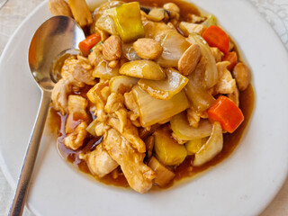 A dish of Asian food, chicken with almonds