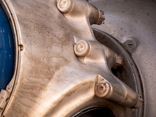 A propeller hub on an aircraft engine, covered in a film of oil.
