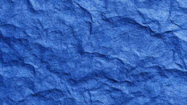 Blue construction paper texture with rough grunge abstract background pattern for modern wallpaper and creative design projects