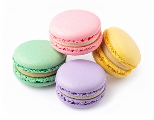 Four colorful French macaron cookies in pastel shades isolated on a white background.