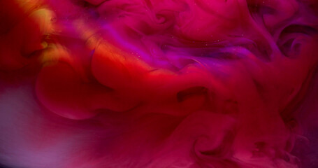 Fototapeta premium Ink explosion. Bright smoke. Pink red color fume swirl spread in water. Arch ray abstract haze texture background beam defocused lens.