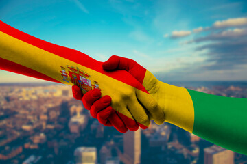 Shaking hands Spain and Guinea