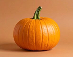 Obraz premium Orange Pumpkin with Natural Ridges and Green Stem Isolated on Brown Background for Vegetable Object, Autumn Harvest and Seasonal Food Concept