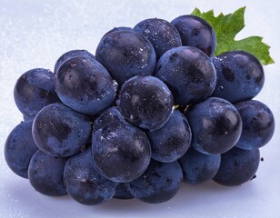 Purple grape cluster with natural shine isolated on white background using clipping path and full depth of field