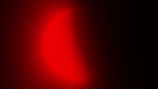 Abstract red glowing crescent light on dark background with smooth futuristic neon rotating effect - Powered by Adobe