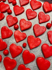 Fototapeta premium red hearts on a white background, red cookies