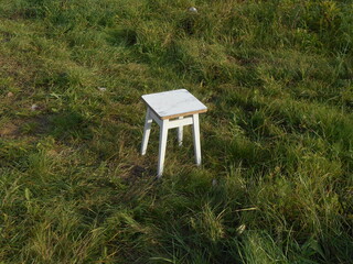 White stool on the grass