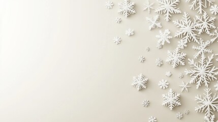 White snowflakes on beige background winter holiday theme