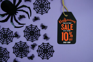 Happy Halloween Sale 10% Off with Price Tag and Halloween elements decorated on purple background
